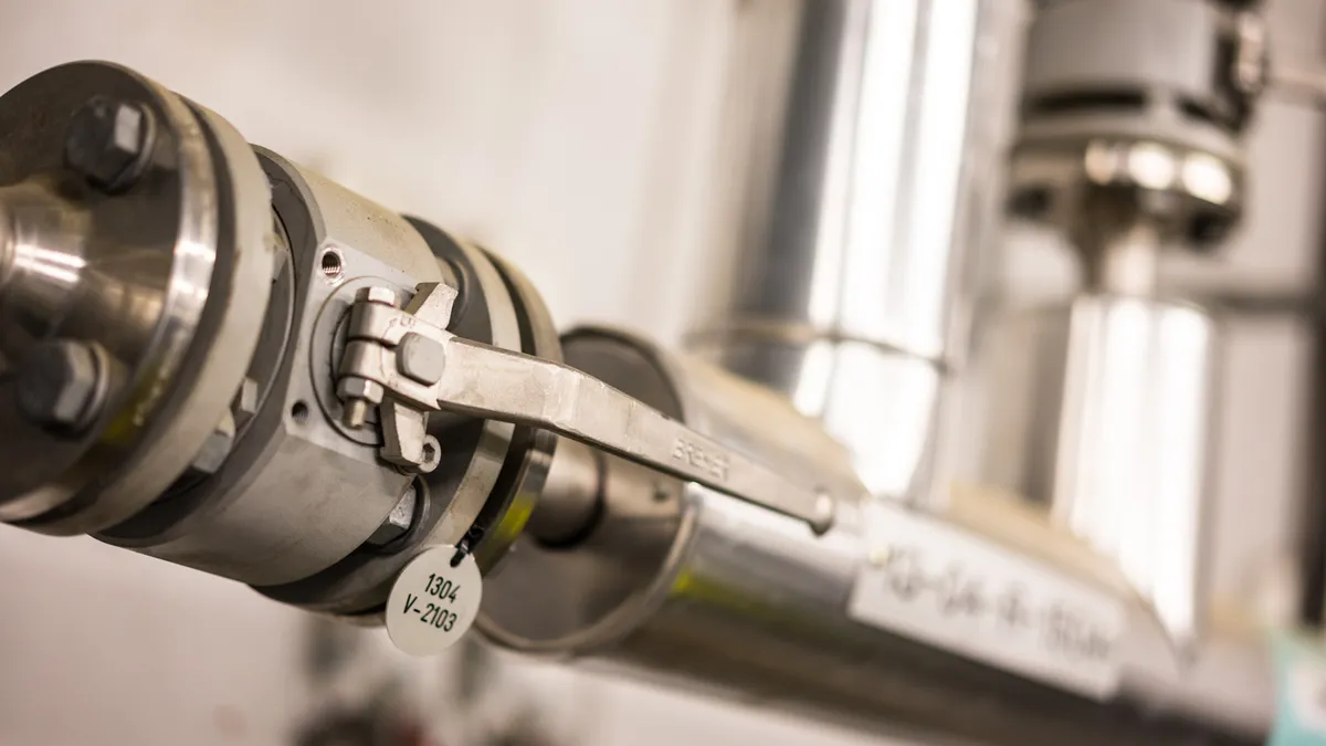 Stainless steel industrial valve with ID tag in gas facility