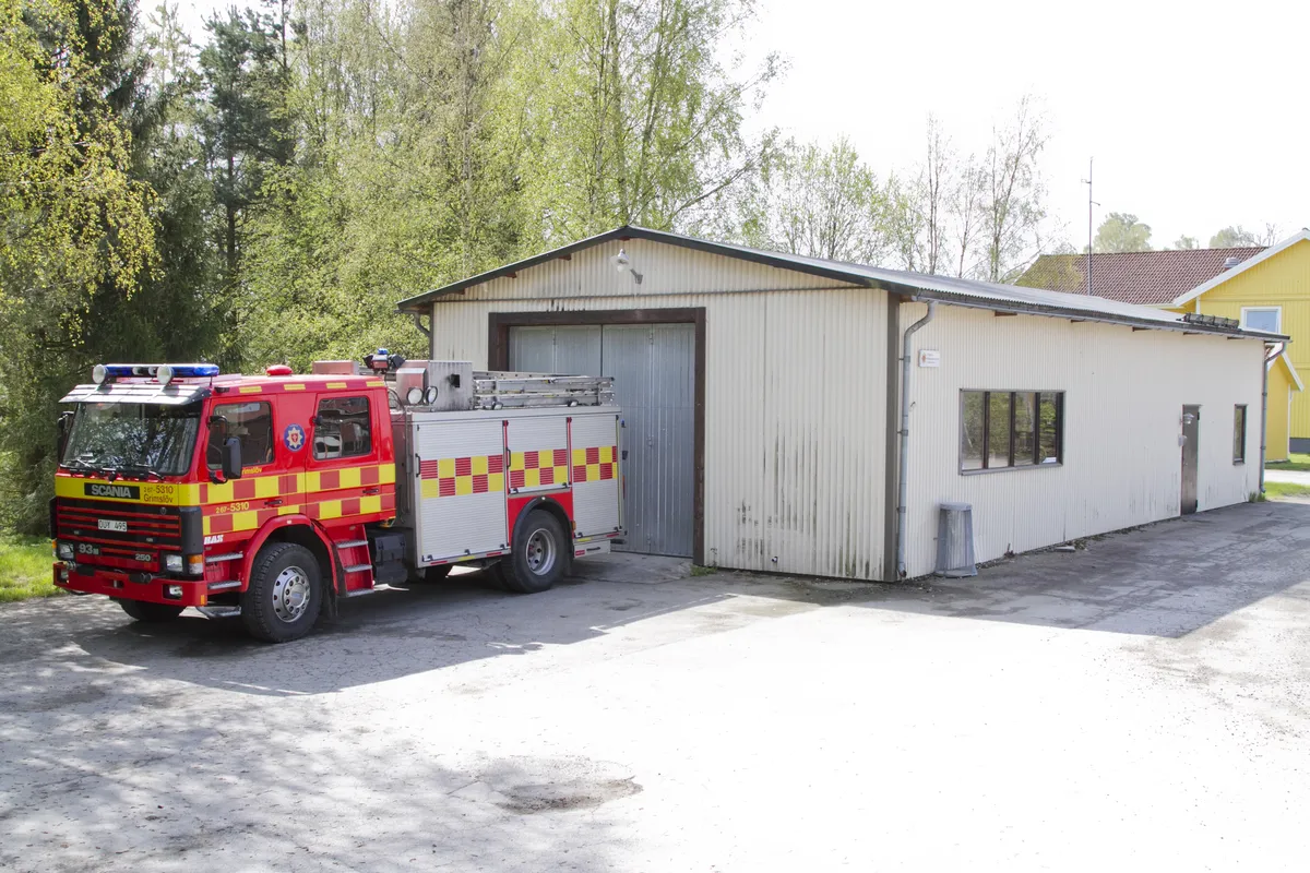 Grimslöv fire station - white building with fire truck outside