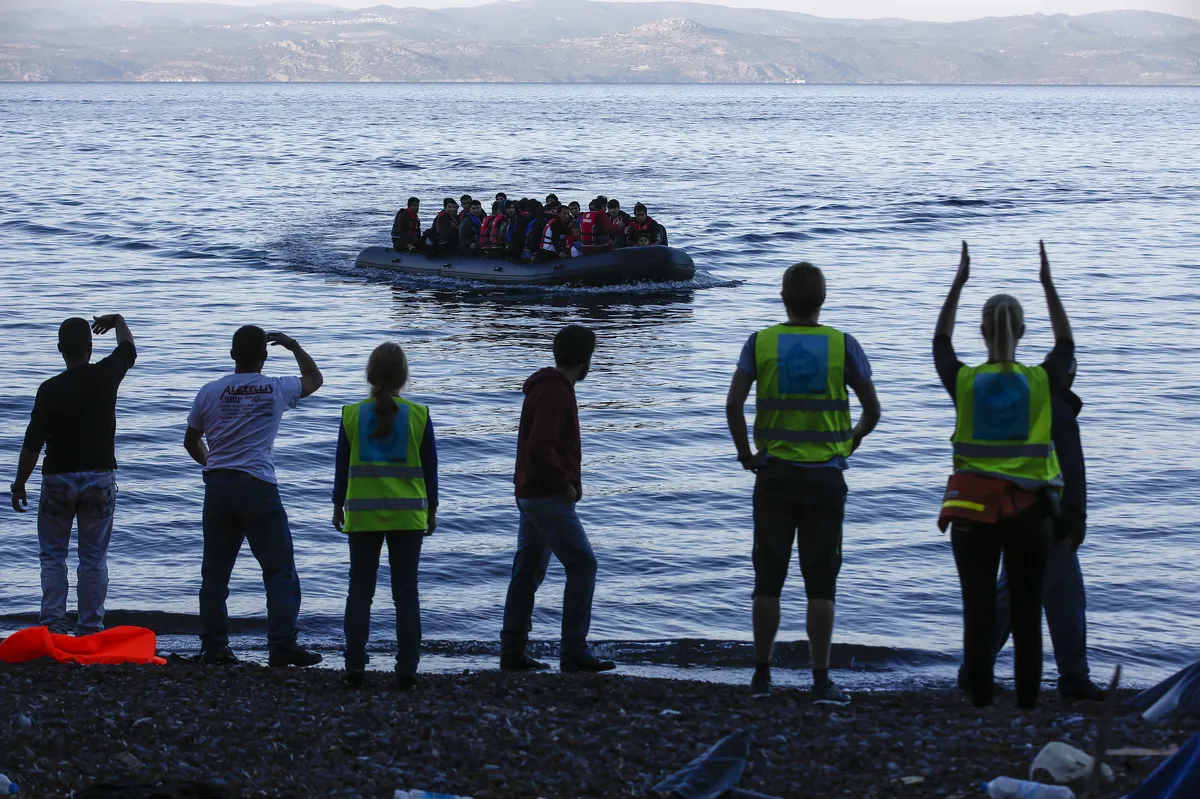 French Police Watch as Migrants Board Dinghy for UK at Dunkirk