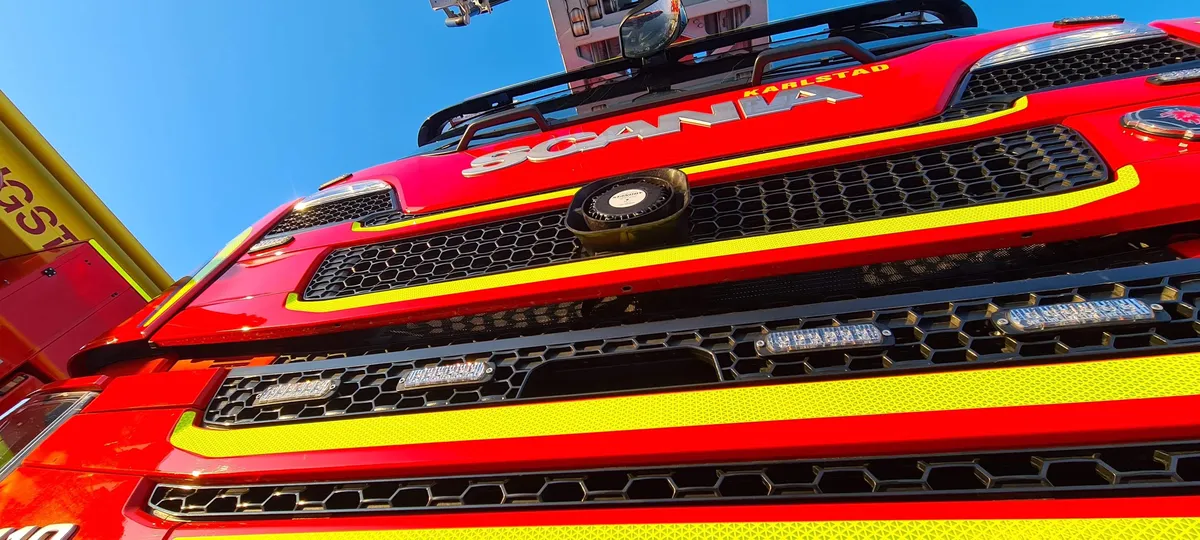 Close-up of the front of a red Scania fire truck from below